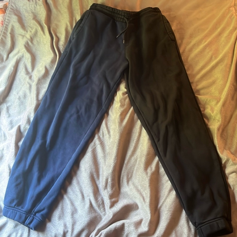 Blue, green, and black Levis (Small) barley worn
